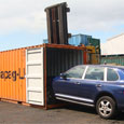 Loading car into container for export